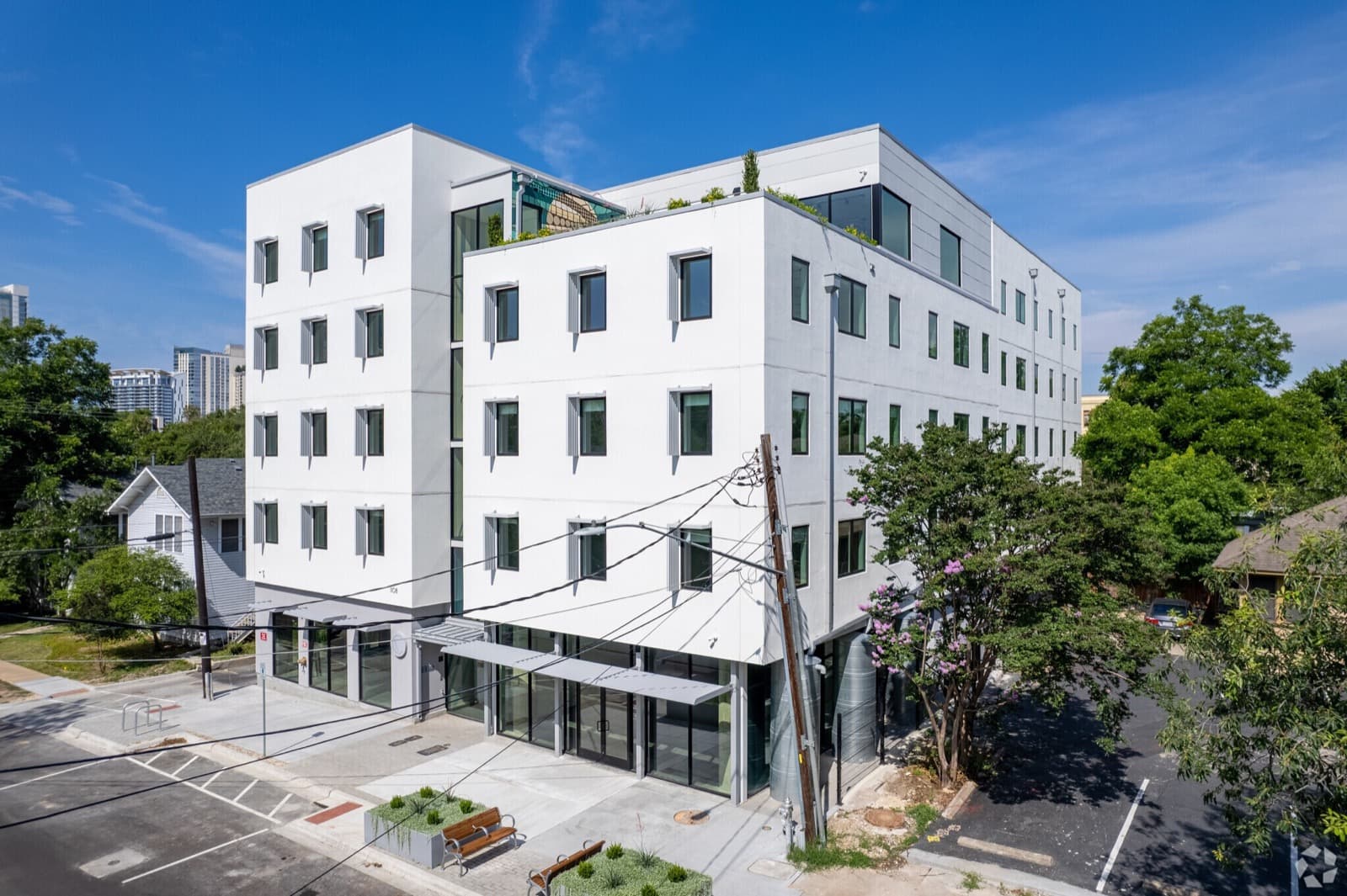 Aerial view of Capitol Living building with rooftop greenery in Downtown Austin