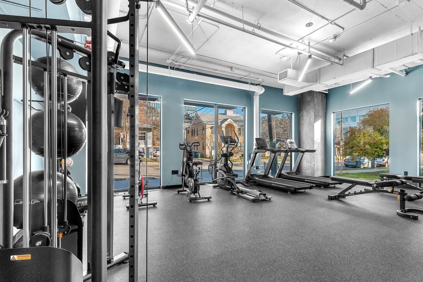 Capitol Living fitness center with treadmills and cardio equipment