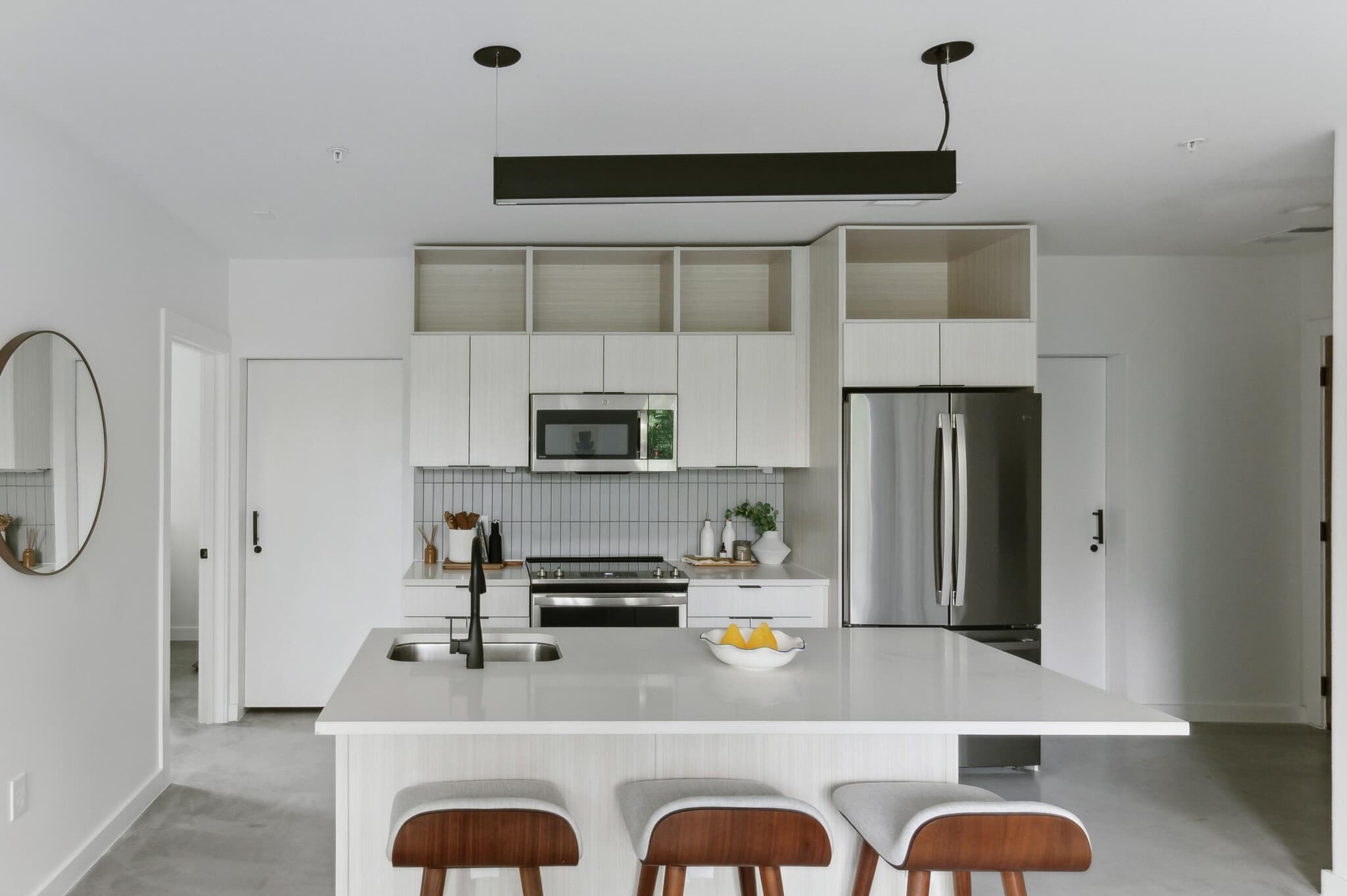 Fully furnished kitchen with quartz countertops at Capitol Living